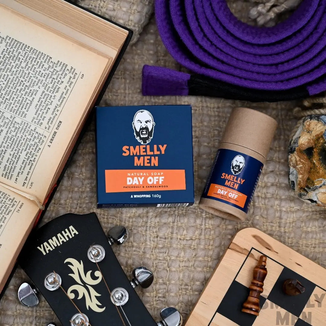 Smelly Men Day Off Essentials kit with a book, guitar and chess board.