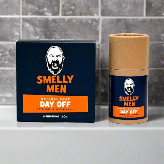 Day Off Essentials Kit by Smelly Men on a bathroom counter with tiles behind.