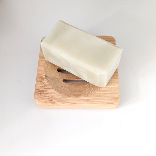 Natural soap bar on a bamboo soap dish