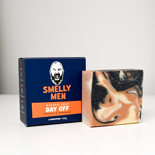 Bar of soap with a 'Smelly Men' packaging on a white background