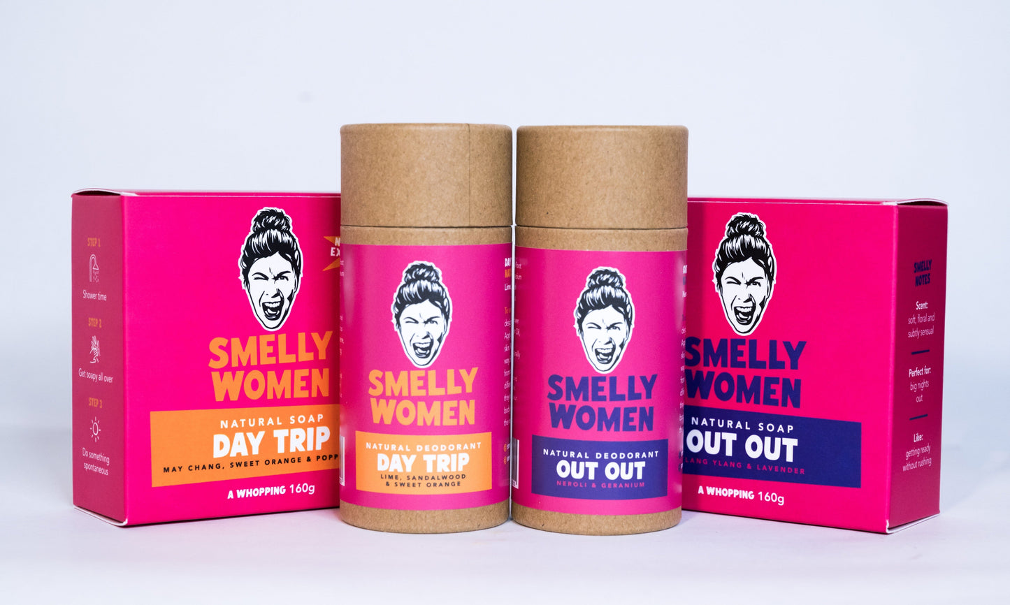 Four containers of 'Smelly Women' natural soap and deodorant on a white background