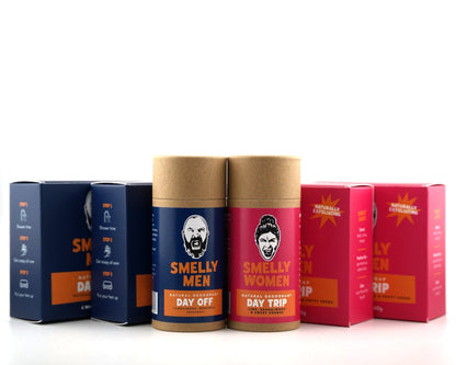 A set of cylindrical cardboard product tubes and matching boxes for a fragrance line, including Smelly Men Day Off and Smelly Women Day Trip, displayed against a clean white background.