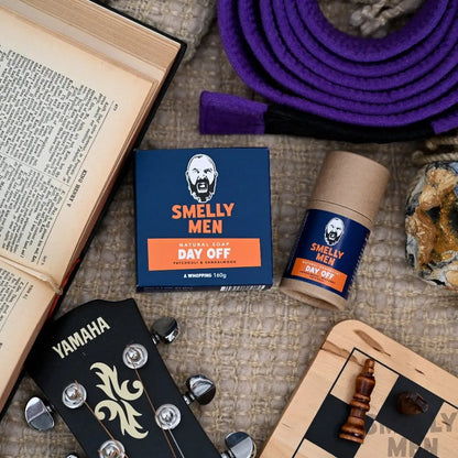 Smelly Men Day Off Essentials kit with a book, guitar and chess board.