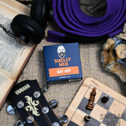 Day Off Soap Patchouli & Sandalwood on a blanket with a chess board and guitar