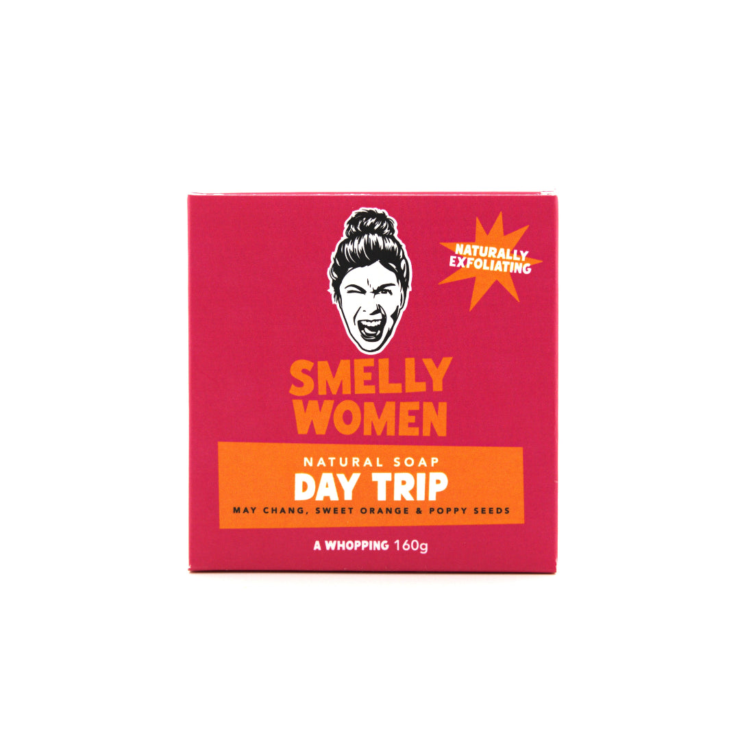 Pink soap box labeled 'Smelly Women Day Trip' on a white background