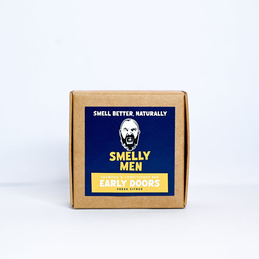 Box of 'Smelly Men' shampoo bar product with a blue label on a white background