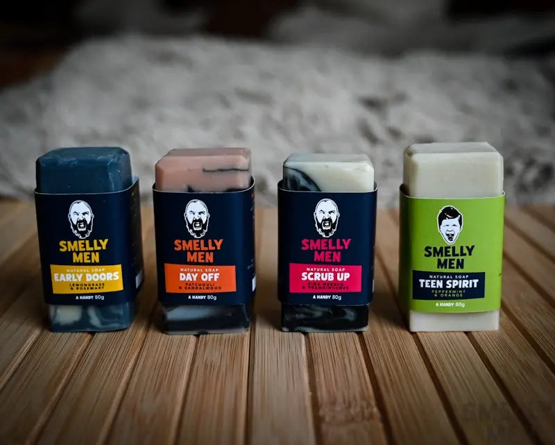Full Buffet travel soaps by Smelly Men on a wooden counter.