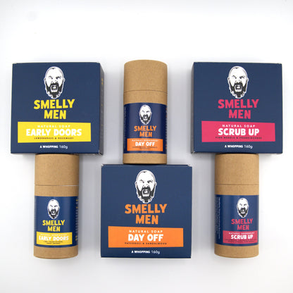 Set of 'Smelly Men' soap products with blue and brown packaging on a white background
