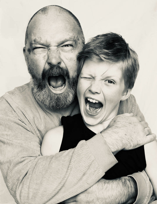 A portrait of a shouting man and his son on a white background.