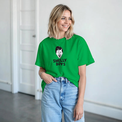 Person wearing a green t-shirt with a graphic design and text, standing indoors.