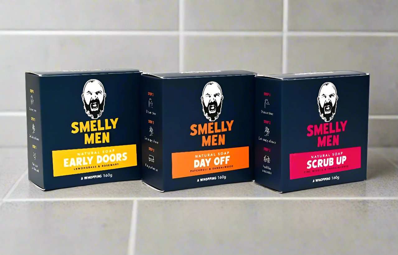 Bases Covered Soap Kit by Smelly Men soap cartons at an angle.