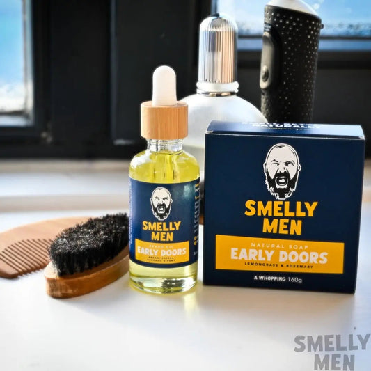 Smelly Men Early Doors Morning Glory Kit with beard oil and soap by a window.