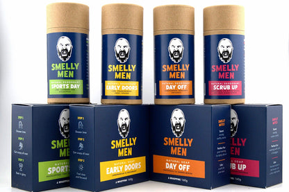 Collection of 'Smelly Men' product containers on a white background