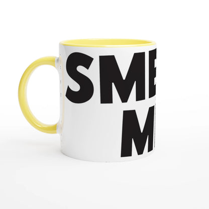 White mug with yellow handle and black text on a white background
