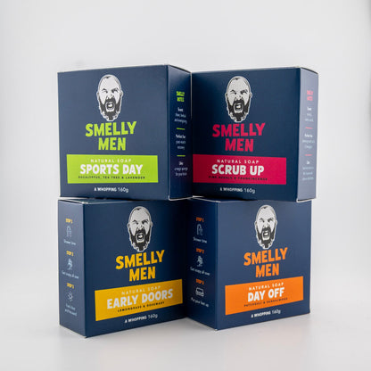 Four boxes of 'Smelly Men' soap with different scents on a white background