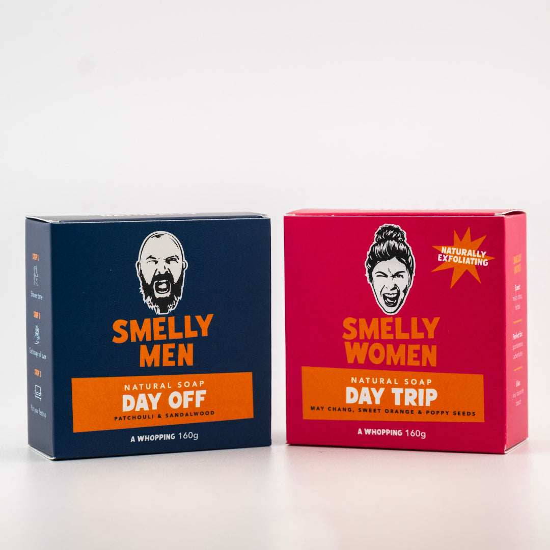 Two boxes of 'Smelly Men' and 'Smelly Women' natural soap on a white background