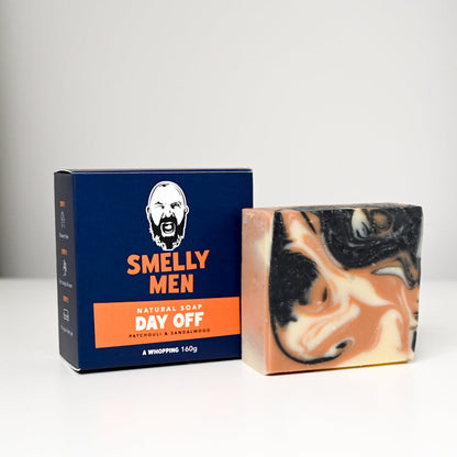 Bar of soap with a 'Smelly Men' packaging on a white background