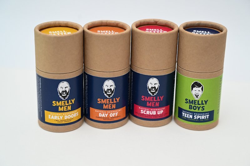 Four cardboard deodorant tubes labeled 'Smelly Men' and 'Smelly Boys' on a white background