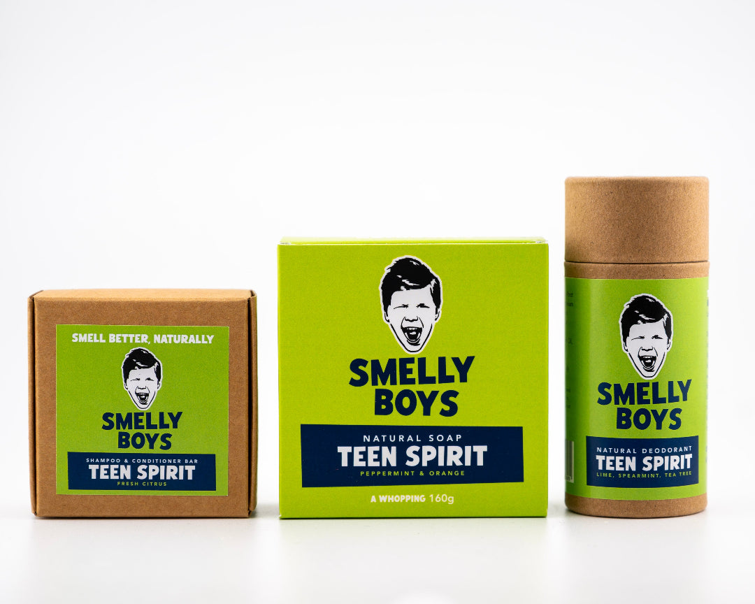 Three 'Smelly Boys' products including a box, soap bar, and deodorant stick on a white background.