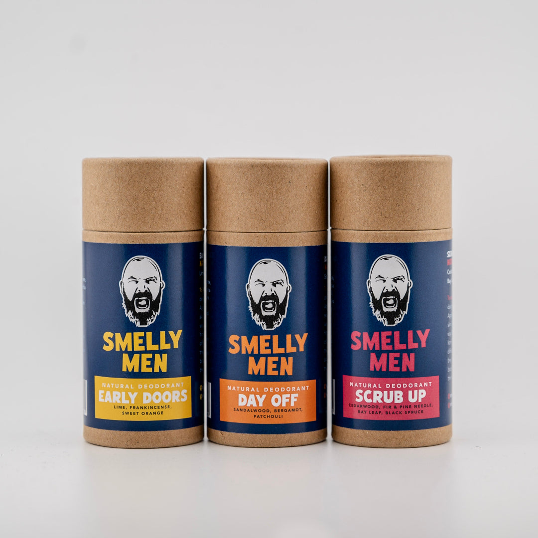 Three 'Smelly Men' deodorant containers on a white background