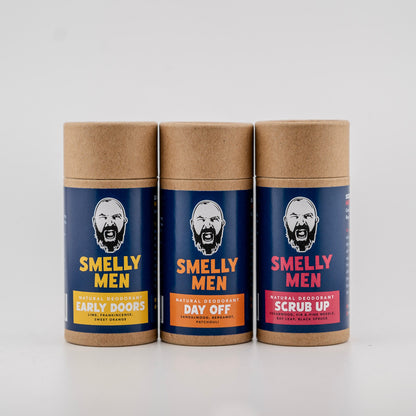 Three 'Smelly Men' deodorant containers on a white background