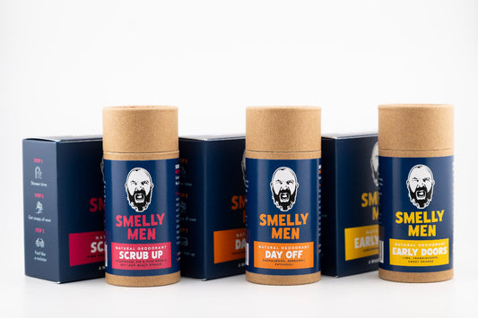 Three 'Smelly Men' soaps and three deodorant tubes on a white background