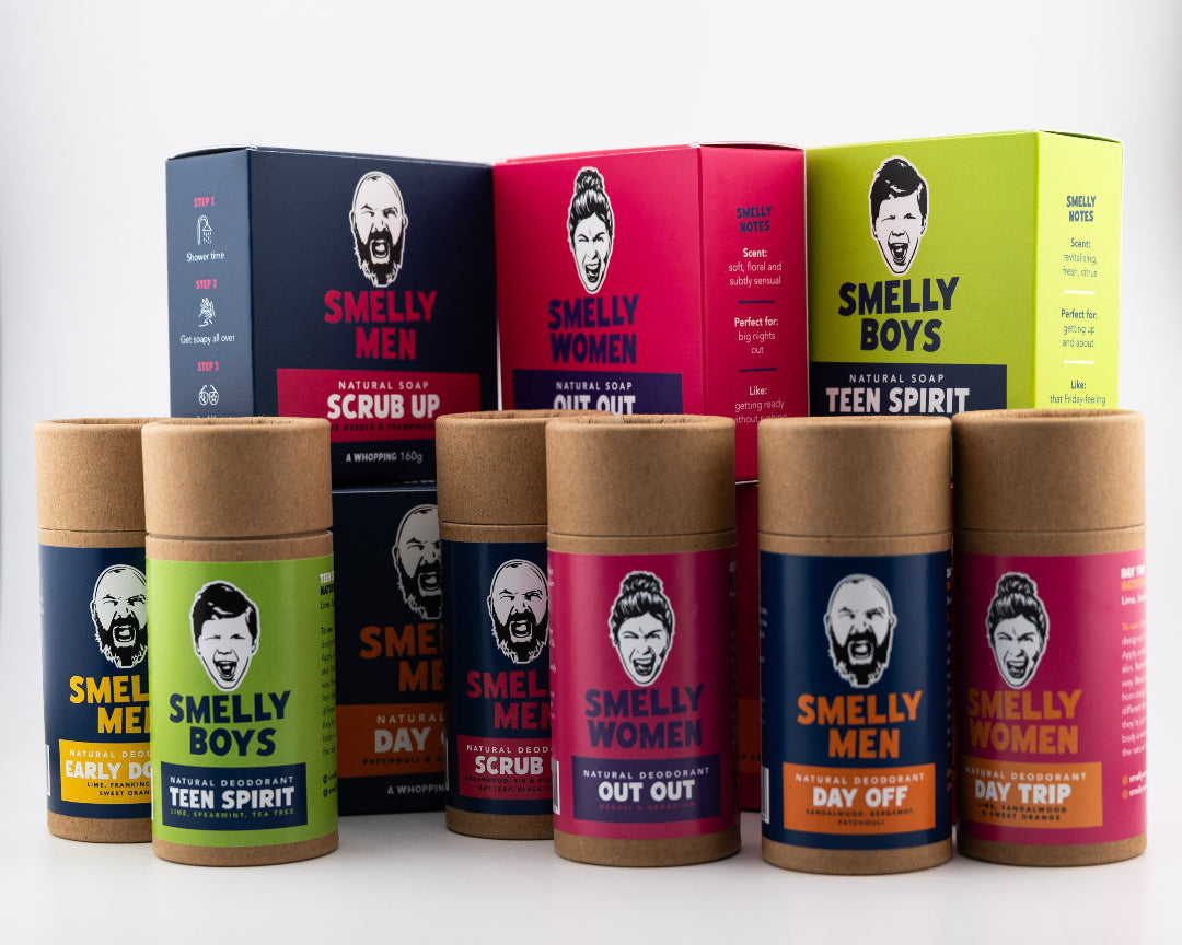 Collection of 'Smelly Men' and 'Smelly Women' product boxes and containers on a white background